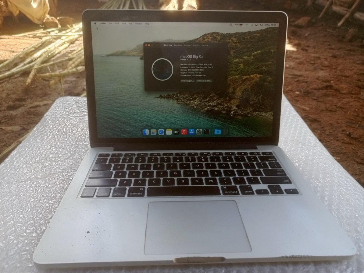 Django with the MacBook open, showing it working